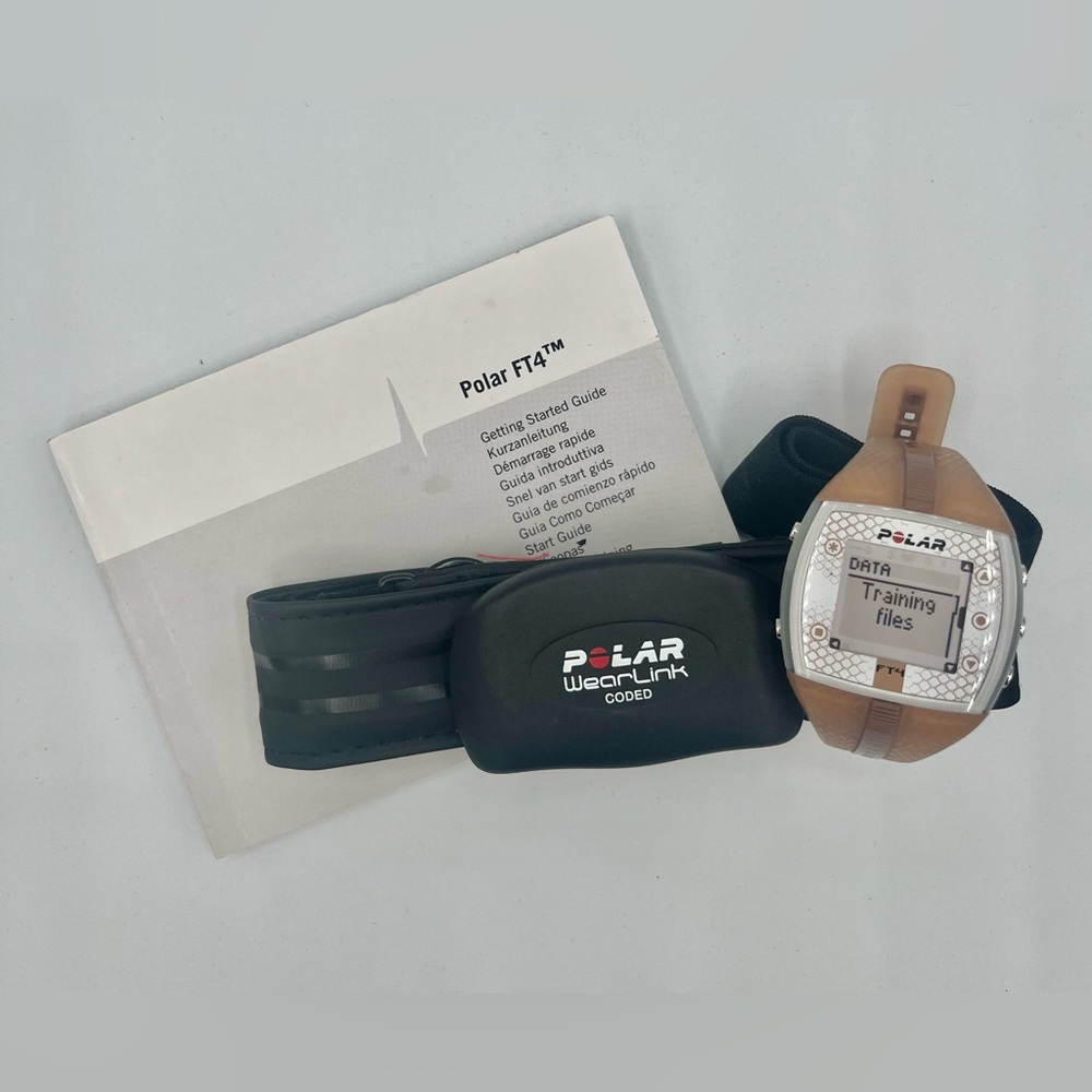 Women’s Polar FT4 watch and heart rate monitor. Copper/tan color. Fitness watch.